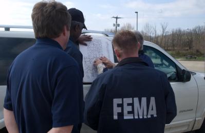 Bollinger County (Marble Hills), MO, March 22, 2008 -- The Chicago FIRST team meets with the Bollinger County Emergency Manager to survey flood da...