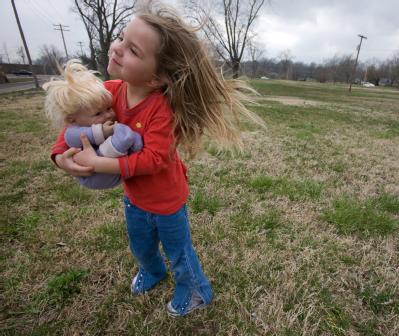 Cape Girardeau, MO, March 27, 2008 -- Four year old, Alison Schaefer and her doll, Delana, stand in a park near their home in Cape Girardeau.    
...