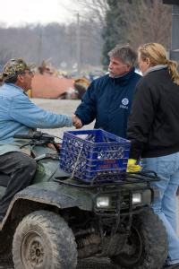 Dutchtown, MO, March 29, 2008 -- FEMA Representative, Jack Heesch talks to flood victims, Doyle and Julie Parmer following the Mississippi river f...