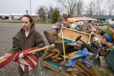 Dutchtown, MO, March 29, 2008 -- Flood victim, Kristin Golden helps her neighbor cleanup  following the Mississippi river flooding in Cape Girarde...