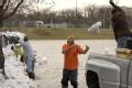 Fenton, MO, March 21, 2008 -- Local residents and area volunteers band together place sandbags on a levee protecting the town from the Meramec Riv...