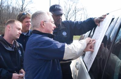 Bollinger County (Marble Hills), MO, March 22, 2008  -- The Chicago FIRST team meets with the Bollinger County Emergency Manager to survey flood d...