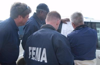 Bollinger County (Marble Hills), MO, March 22, 2008  -- The Chicago FIRST team meets with the Bollinger County Emergency Manager to survey flood d...