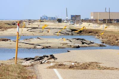 Galveston, Texas, September 30, 2008 -- Roads have been heavily damaged from Hurricane Ike as the ground eroded under the paving from storm surge ...