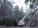 Little Rock, AR   December 29, 2000 -- Power workers remove ice and tree branches from power cables.                                        Photo ...