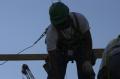 Arlington, VA, March 7, 2002 -- Construction workers continue work on top of the Pentagon. The reconstruction is a result of a terrorist attack on...