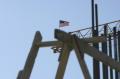 Arlington, VA, March 7, 2002 --  A flag waves in the wind which is on top of a crane used in reconstruction efforts at the Pentagon.  Rebar is in ...