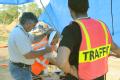 Jacksonville, FL, September 18, 2008 -- FEMA Debris Specialist Ray White(left) oversees the actions of Site Monitor Carol Carroll and Tower Monito...