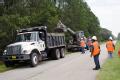Hilliard, FL, September 18, 2008 -- Nassau County Road and Bridge Department crew clean debris from a drainage ditch which was flooded by Tropical...