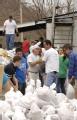 Fenton, MO, 03/21/2008 -- Local residents and volunteers prepare sandbags and create walls to prevent the potential flood water from flooding loca...