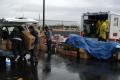 Fernley, NV, January 12, 2008 -- People load a car with boxes of food and cleaning supplies at a Red Cross distribution center to help flood victi...