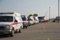Beaumont, TX August 31, 2008--Ambulances line up for assignments in Beaumont, Texas.  These units transport  patients with special medical needs o...