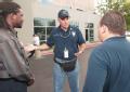 Atlanta, GA, August 31, 2008 -- FEMA Urban Search and Rescue (US&R) Information Officer Louie Fernandez, left, briefs Travis Andrews, staff assist...