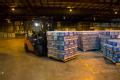 Lufkin, TX, September 2, 2008 -- A member of the Texas Forest Service moves pallets of water in a warehouse in Lufkin, TX.  The warehouse is being...