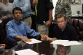 Houma, LA, September 2, 2008 -- Governor Bobby Jindal holds  Parish President Michel Claudet hand, comforting him during this difficult time about...