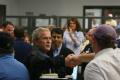 Baton Rouge, LA, September 3, 2008 -- President George W. Bush shakes hands with employees at the EOC, during disaster recovery efforts for Hurric...