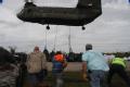 New Orleans, LA, September 3, 2008 -- A staging area on a highway in Plaqumines Parish, a Chinook helicopter lifts sand bags to repair a broken le...
