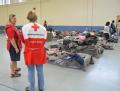 Tyler, TX, September 3, 2008 -- Red Cross workers look at evacuees gathering their belongings in preparation for their return to Beaumont, TX.  Th...