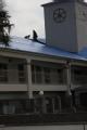 Baton Rouge, LA, September 7, 2008 -- A large blue tarp is placed on top of a building by workers, that sustained severe damage during Hurricane G...