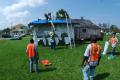 Larose, LA, September 7, 2008 -- Local contractors working with the U S Army Corps of Engineers, apply FEMA Blue Tarps to protect this home and th...