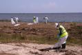 Bay St Louis, MS, September 9, 2008 -- Work crews collect debris left by Hurricane Gustav on this Gulf of Mexico beach in Hancock County.  Many un...