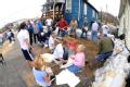 Fenton, MO, March 21, 2008 -- Local residents and volunteers prepare sandbags and create walls to prevent the potential flood water from flooding ...