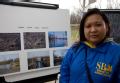Cape Girardeau, MO, March 27, 2008 -- SBA Representative Olivia Humilde studies before and after flood photos of an area that participated in a FE...