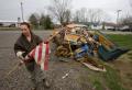 Dutchtown, MO, March 29, 2008 -- Flood victim Kristin Golden helps her neighbor cleanup following the Mississippi river flooding in Cape Girardeau...
