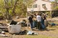 Oak Island, TX, October 25, 2008 -- A group of teenagers from a San Antonio, TX church group cleans up debris at a home in Oak Island, TX that was...
