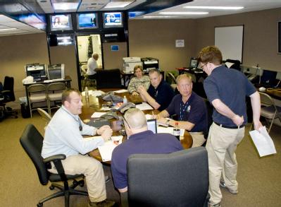 Weslaco, Texas, July 26, 2008 -- A planning meeting in the FEMA command center brings together State, Military and FEMA personnel to coordinate ap...