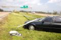Port Arthur, TX, September 25, 2005- A car is crushed by a fallen street light on Route 69  near Port Arthur.  Port Arthur was hit hard by Hurrica...