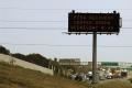 Houston, TX, 9/27/05 -- A freeway sign on Interstate 10 announces the opening of the FEMA recovery center. Hurricane Rita and Katrina victims can ...