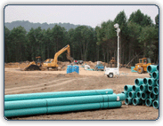 Graphic of drainage pipes and bulldozers preparing to install the pipes.