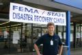 Thibodaux, LA  November 14, 2005 - Evan Smith posed in front of the FEMA Disaster Recovery Center he manages in south central Louisiana.  Evan is ...