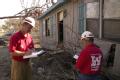 Empire, LA, 11-10-05 -- The U.S. Army Corps of Engineers' John Clarkson & Ronald Moll identify a house that Hurricane Katrina moved so they can no...