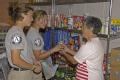 Cameron, LA, 11-11-05 -- AmeriCorps volunteers Dedrick Braggs & Javonte Bnoks help Ashley Brooks shop for donate food items at this Cameron food b...