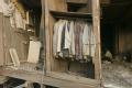 New Orleans, LA., 11/01/2005 -- A closet with suits hanging exposed to the outside elements at a home that was destroyed in the Lower 9th Ward due...