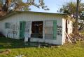 Pecan Island, LA, 1-27-06 -- This homeowner has left information on his damaged home and painted his phone number on the wall so that FEMA can con...