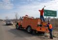 Cameron, LA, 1-27-06 -- Workmen Mark Lamb and Ray Ford Andrun replace road signs that Hurricane Rita wiped out on Hwy 27/82.    FEMA is helping Lo...