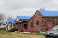 Lake Charles, LA, February 22, 2006 - FEMA's blue roof program provides tarps to temporarily protect dwellings from further rain damage.  FEMA enc...