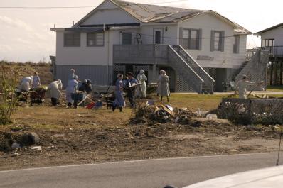 Grand Isle, LA, 11-04-05 -- A group of Mennonite's from differents states helps clean up this disaster victims yard.
Mennonite's from across the ...
