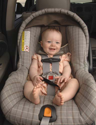 Baby secured in car seat