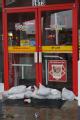 Brownsville, TX, July 23, 2008 -- Sand bags line the bottom of the front door of a temporarily closed gas station. Business owners are taking prec...