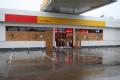 Brownsville, TX, July 23, 2008 -- Local gas stations and convenient stores with boarded up windows and doors; Many stores were closed for the day ...