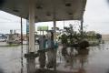 Brownsville, TX, July 23, 2008 -- A downed tree blocks a lane in a local gas station. Most all gas stations have closed. Hurricane Dolly crossed S...