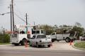 Brownsville, TX, July 24, 2008 -- Electrical power crews work hard trying to restore power to residents and businesses. Power lines have falling d...