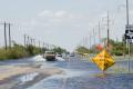 Los Fresnos, Texas, July 28, 2008 -- Residents of Los Fresnos ignore the signs posted by police.  Many parts of South Texas are still under water ...