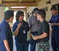 Brownsville, TX, August 9, 2008 -- Sgt. Diane Baily of the Air Service National Guard discusses distribution activities with FEMA personnel at the...