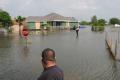 Hildalgo County, TX, July 30, 2008 -- Eight days following Hurricane Dolly's landfall, residents were still cut off by flood waters and had to wad...
