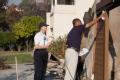 Rancho Bernardo, CA, October 28, 2007 -- FEMA Community Relations specialists walk through a Rancho Bernardo neighborhood distributing disaster in...